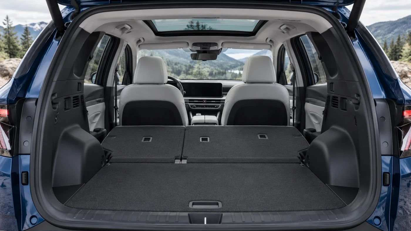 AI illustration of an empty Tucson cargo compartment with both rear seatback sections folded