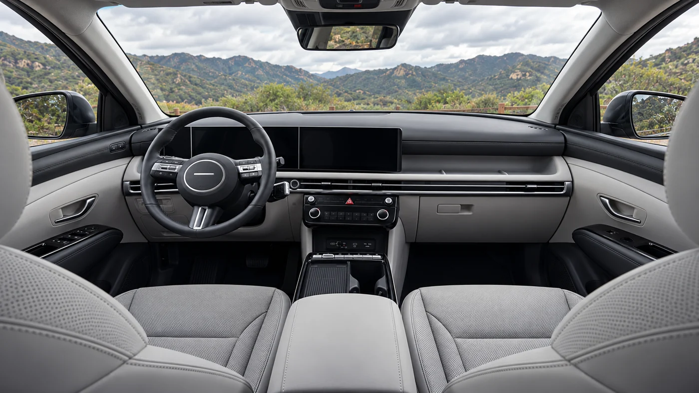 AI illustration of the Tucson Limited front cabin with gray seats and a wide dashboard