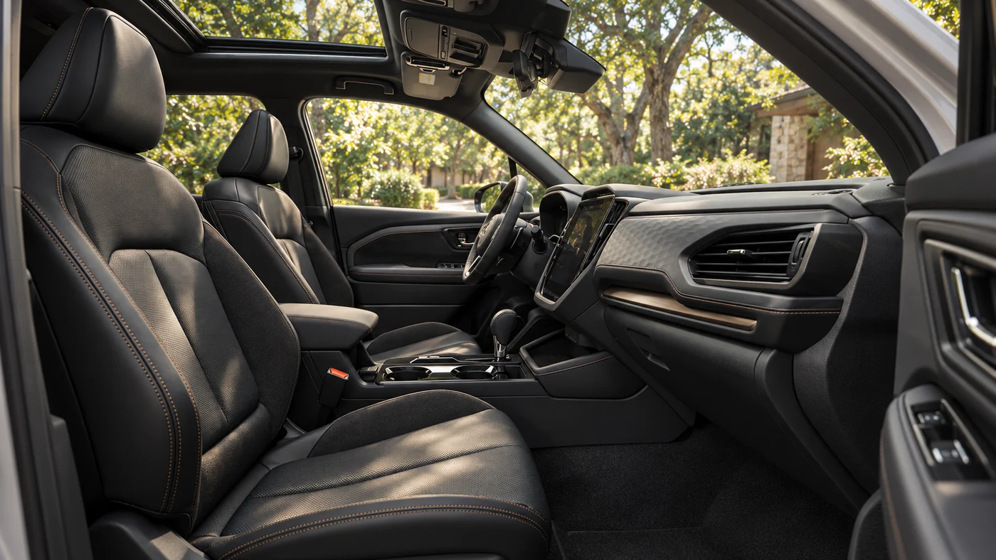 AI-generated illustration of a 2026 Subaru Forester Touring front cabin with black leather seats and a moonroof